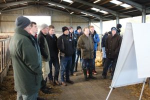 Group of farmers in a shed listening to a presentation
