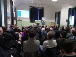 Village hall full of people at a meeting