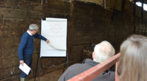 Wormiston Farm - Chris McDonald explaining the nurtrient budget during a farm meeting, inside a silo shed
