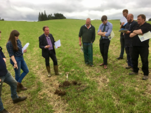 Wormiston Farm - Paul Hargreaves explaining compaction to a group of people in a grassland field