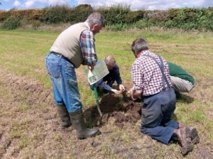 Farmers assessing soil structure