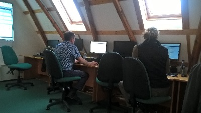 People working at a computer at a training day