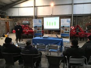 Jonathan Black discussing Take-all disease at a farmer meeting inside a shed