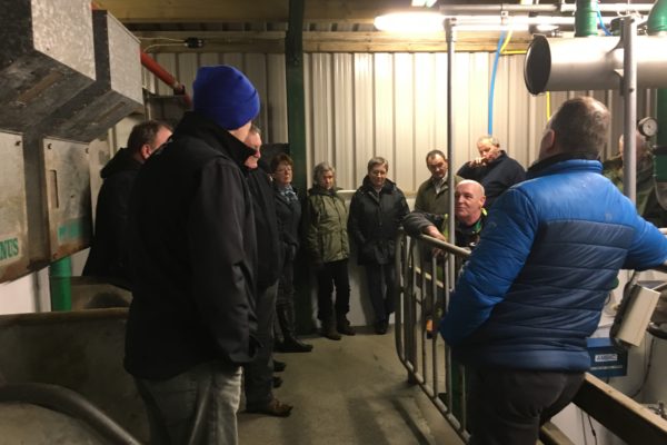 A group of farmers join Gordon MacKay at Moorpark Dairy on the Isle of Lewis