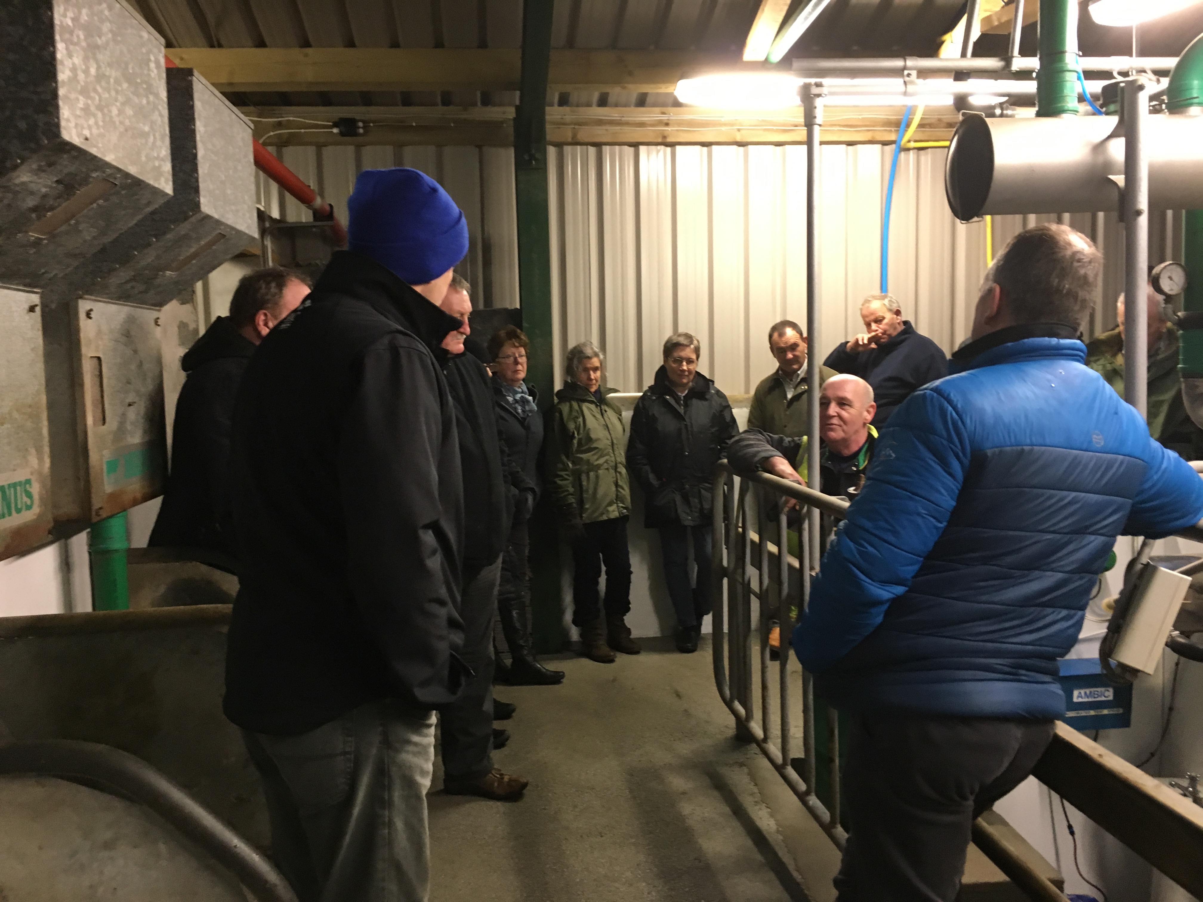 A group of farmers join Gordon MacKay at Moorpark Dairy on the Isle of Lewis