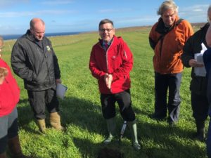 Gavin Elrick, soil & drainage expert from SAC Consulting, discussing soil health in a grassland field near Stornaway