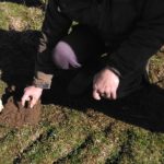 Gavin Elrick, soil & drainage expert, examining soil structure at Waternish Farm, Skye