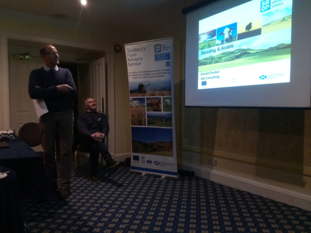 Donald Dunbar, agricultural advisor, giving a presentation to a room of farmers