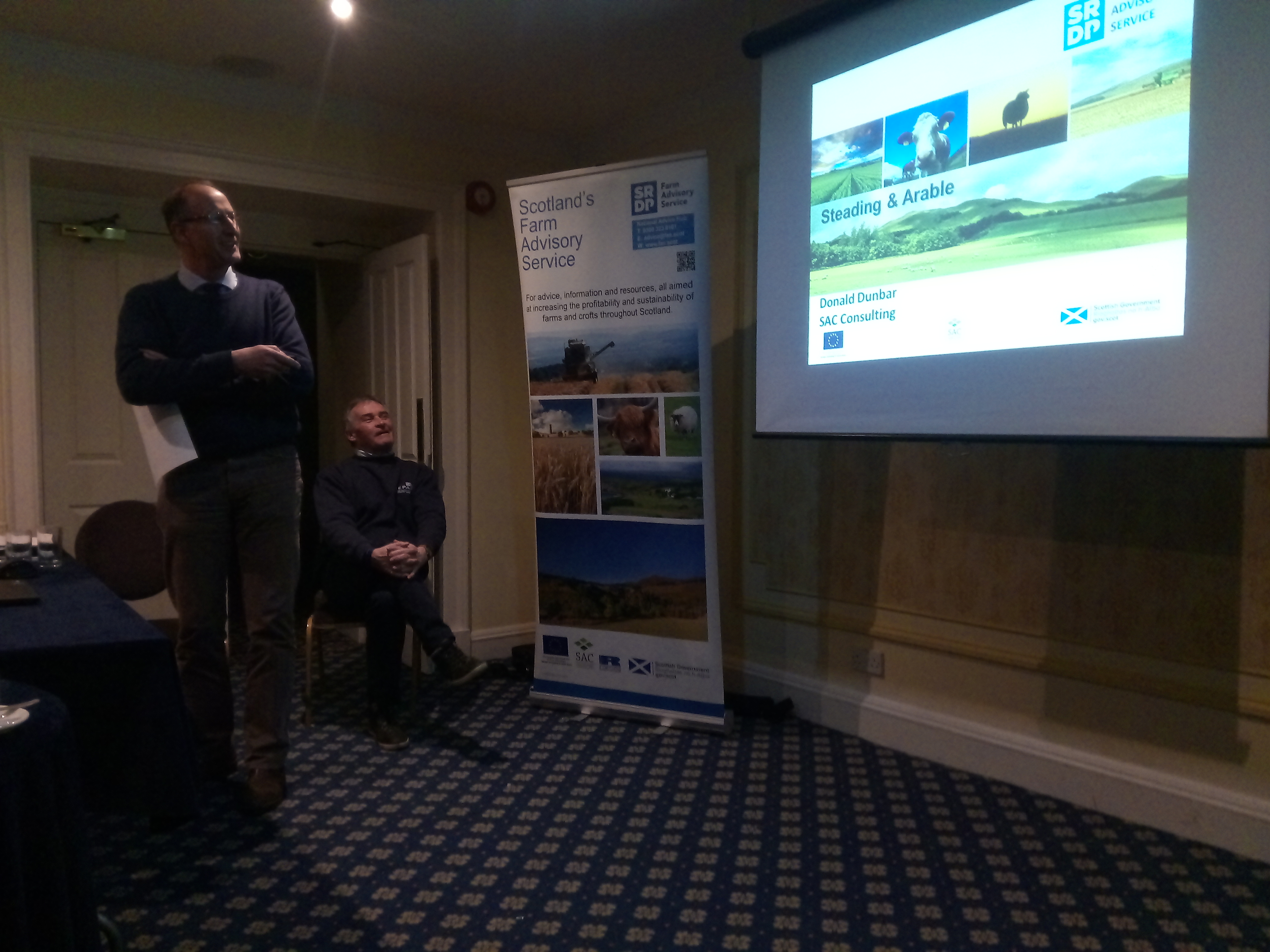 Donald Dunbar, agricultural advisor, giving a presentation to a room of farmers