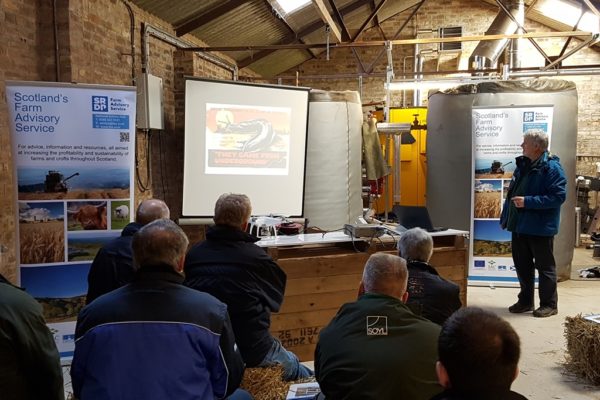 Farmers watching presentation slides by Andy Evans discussing ICM of slugs and pests at the Laurencekirk ICM event