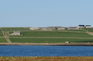A photo showing Midgarth Farm, Orkney from afar