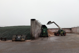 Photo of two silage pits at Bogindollo Farm, one full and fully covered, the other has a telehandler working in it.