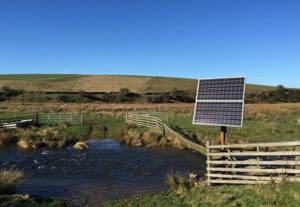 Solar panel at a wide watering point in a watercourse