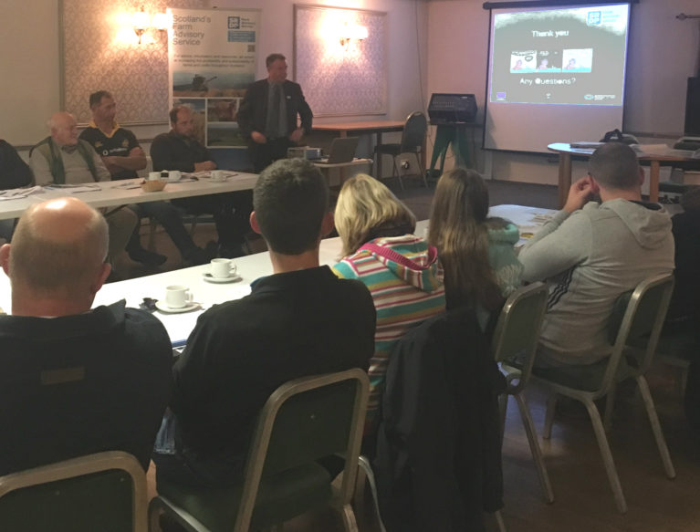 Stranraer Soil & Nutrient Network - second meeting - a group of farmers sitting around a table listening to a presentation from Dr Paul Hargreaves