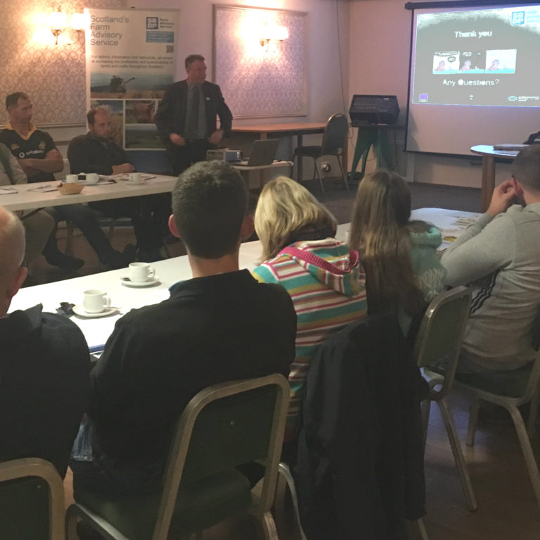 Stranraer Soil & Nutrient Network - second meeting - a group of farmers sitting around a table listening to a presentation from Dr Paul Hargreaves