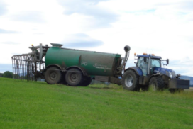 tractor spreading slurry or digestate using a dribble bar