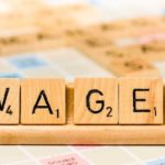 Wages in scrabble letters
