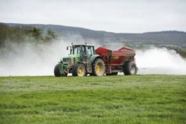 Tractor spreading lime