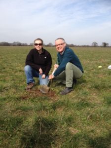 A photo of Quentin Clark, Head of Sustainabilty at Waitrose, planting a tree at Warcop. The photo credit goes to the Woodland Trust
