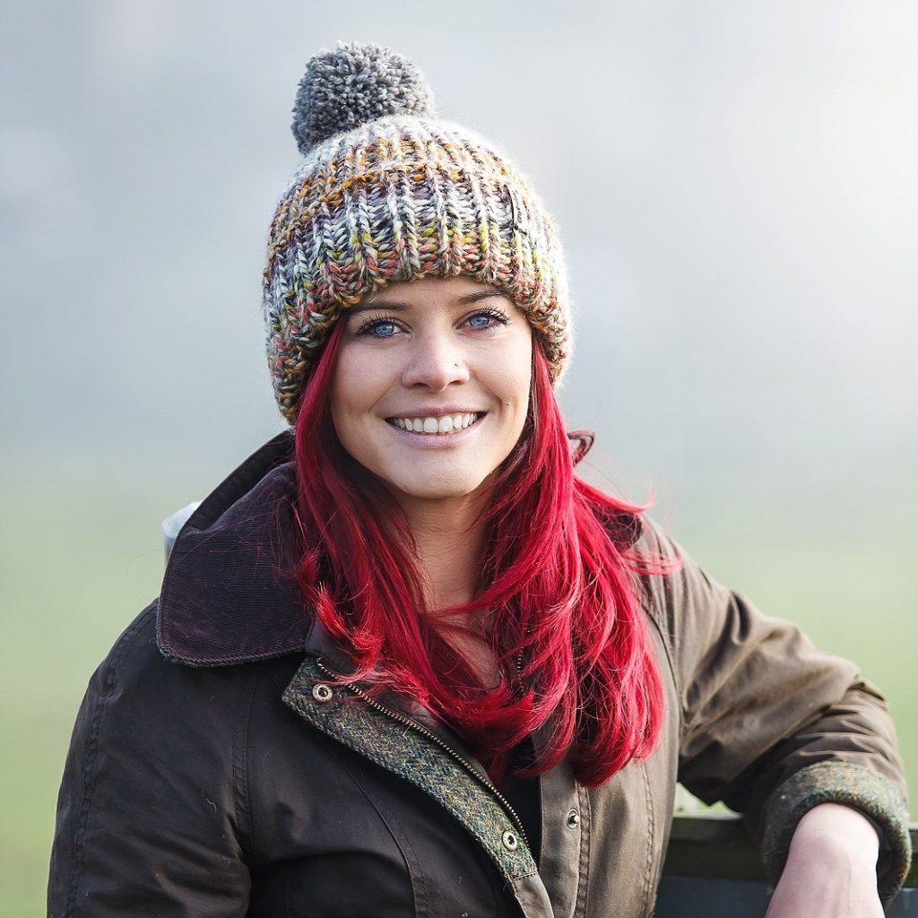 Hannah Jackson stood at a gate, smiling.