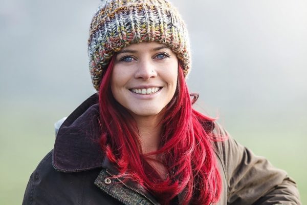 Hannah Jackson stood at a gate, smiling.