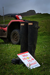 Book sitting on wellies and with a quad bike in the background