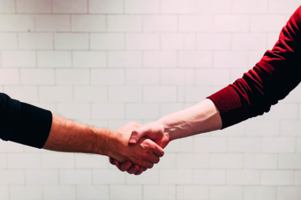 Two people shaking hands