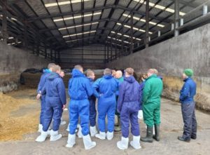 Group of people standing in a shed