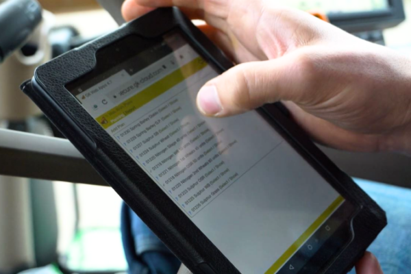 farmer using tablet in tractor