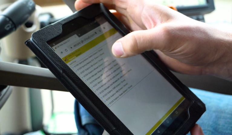 farmer using tablet in tractor