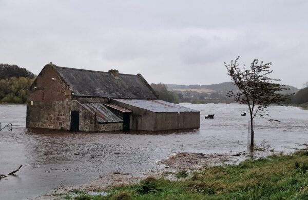 Flood water surrounding a cottage