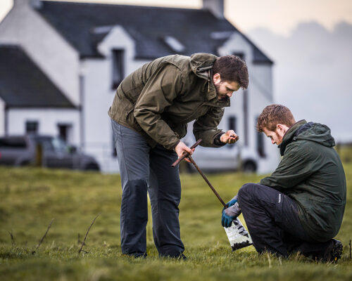 Two People soil sampling