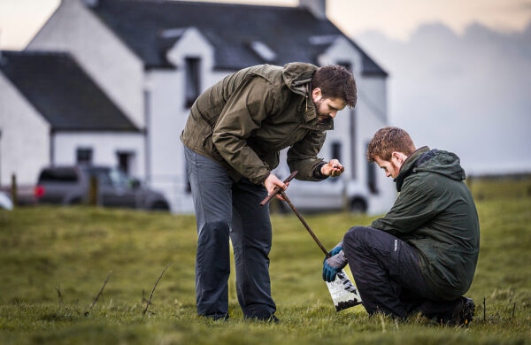 Two People soil sampling