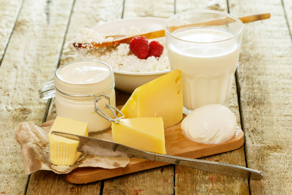 Board of cheese, yoghurt and milk
